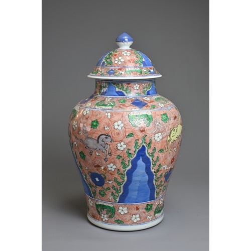 31 - A CHINESE WUCAI PORCELAIN HORSE JAR AND COVER, PROBABLY 18TH CENTURY. Of baluster form with wide rou... 