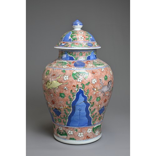 31 - A CHINESE WUCAI PORCELAIN HORSE JAR AND COVER, PROBABLY 18TH CENTURY. Of baluster form with wide rou... 