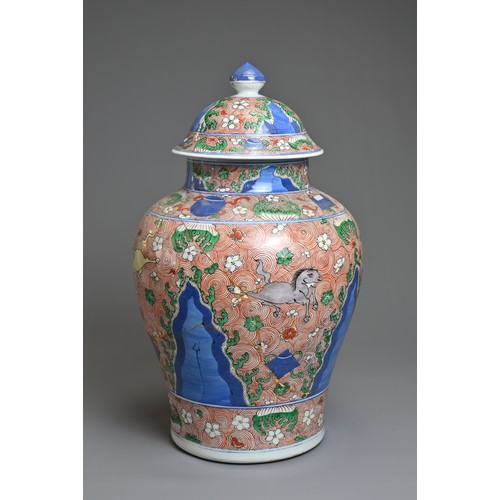 31 - A CHINESE WUCAI PORCELAIN HORSE JAR AND COVER, PROBABLY 18TH CENTURY. Of baluster form with wide rou... 