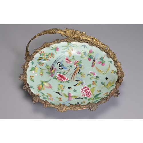 36 - A MOUNTED CHINESE CELADON GROUND FAMILLE ROSE DISH, 19TH CENTURY. The dish decorated with birds, but... 