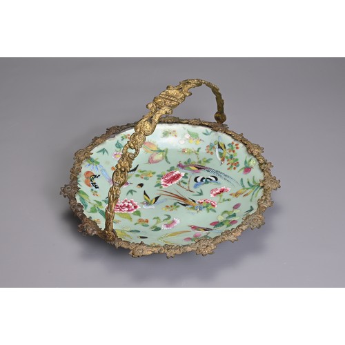 36 - A MOUNTED CHINESE CELADON GROUND FAMILLE ROSE DISH, 19TH CENTURY. The dish decorated with birds, but... 