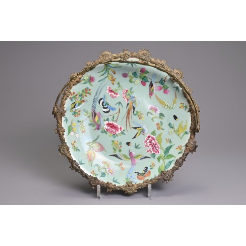 36 - A MOUNTED CHINESE CELADON GROUND FAMILLE ROSE DISH, 19TH CENTURY. The dish decorated with birds, but... 