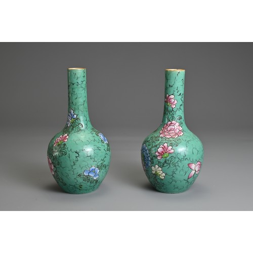 41 - A PAIR OF CHINESE PORCELAIN BOTTLE VASES, 19TH CENTURY. Green ground decorated with peony blossoms. ... 