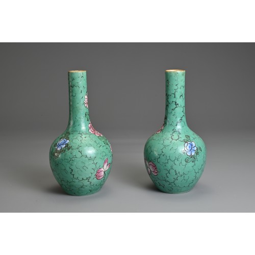 41 - A PAIR OF CHINESE PORCELAIN BOTTLE VASES, 19TH CENTURY. Green ground decorated with peony blossoms. ... 