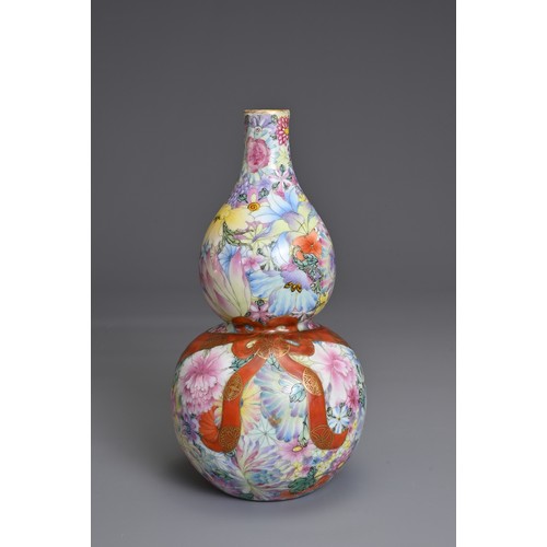 48 - A CHINESE MILLEFLEURS DECORATED DOUBLE GOURD PORCELAIN VASE, QIANLONG MARK. Decorated with colourful... 