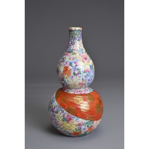 48 - A CHINESE MILLEFLEURS DECORATED DOUBLE GOURD PORCELAIN VASE, QIANLONG MARK. Decorated with colourful... 