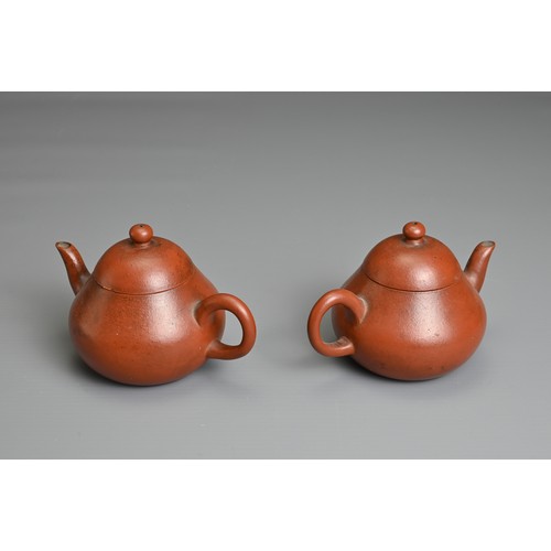 59 - A PAIR OF SMALL CHINESE YIXING POTTERY TEAPOTS, MENG CHENG MARK. Undecorated with inscribed poem to ... 