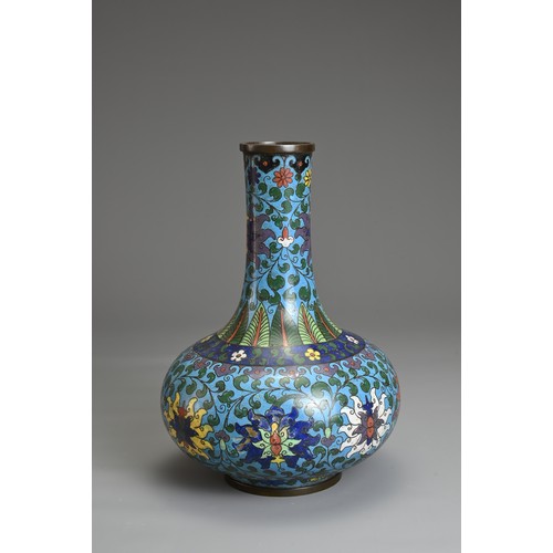 69 - A CHINESE CLOISONNE ENAMEL BOTTLE VASE, EARLY 20TH CENTURY. Decorated with chrysanthemums with leafy... 