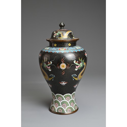 70 - A CHINESE CLOISONNE ENAMEL VASE AND COVER, EARLY 20TH CENTURY. Black ground with dragons chasing fla... 