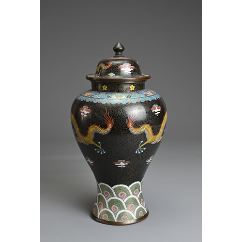 70 - A CHINESE CLOISONNE ENAMEL VASE AND COVER, EARLY 20TH CENTURY. Black ground with dragons chasing fla... 