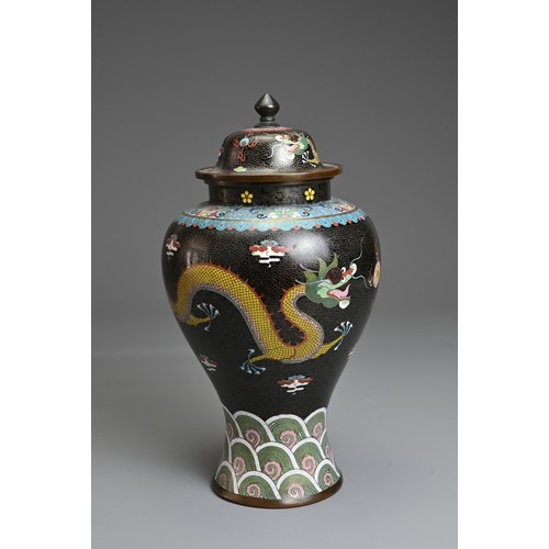 70 - A CHINESE CLOISONNE ENAMEL VASE AND COVER, EARLY 20TH CENTURY. Black ground with dragons chasing fla... 