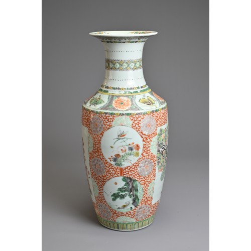 74 - A CHINESE FAMILLE ROSE PORCELAIN VASE, 19TH CENTURY.   Of baluster form decorated with rectangular p... 