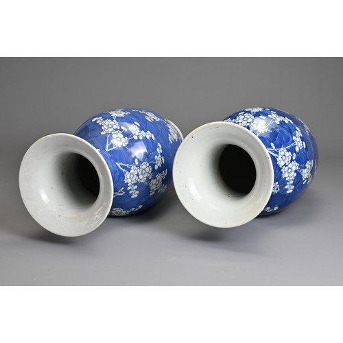 78 - A GOOD LARGE PAIR OF CHINESE BLUE AND WHITE PORCELAIN PRUNUS VASES, 19TH CENTURY. Each of baluster f... 