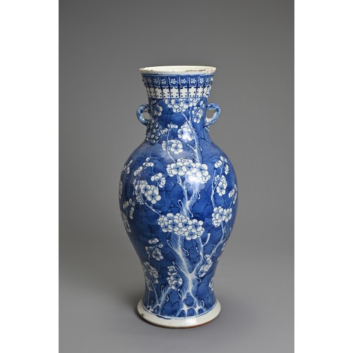 79 - A CHINESE BLUE AND WHITE PORCELAIN VASE, 19TH CENTURY. Of baluster form with two looped handles, wit... 