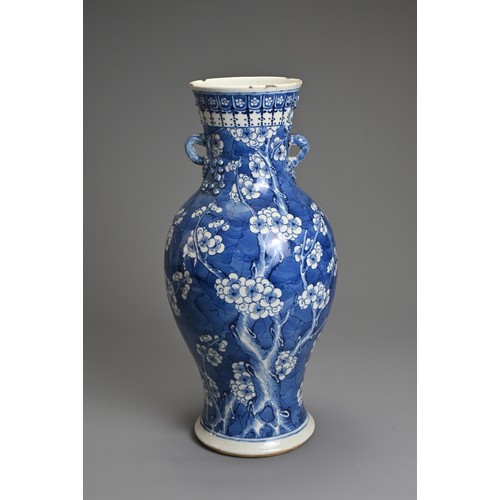 79 - A CHINESE BLUE AND WHITE PORCELAIN VASE, 19TH CENTURY. Of baluster form with two looped handles, wit... 