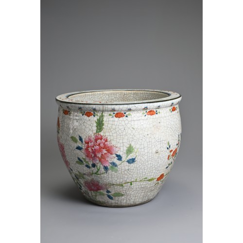 81 - A CHINESE CRACKLE GLAZED PORCELAIN JARDINIERE, 19TH CENTURY. Famille rose enamelled decoration of bu... 