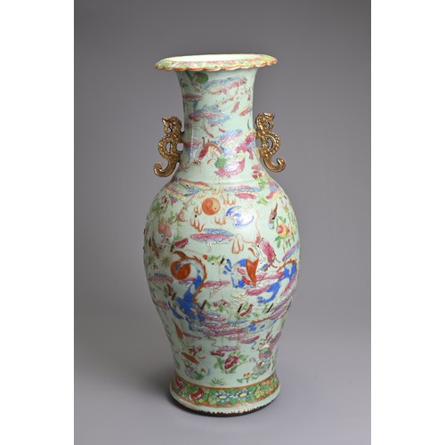 83 - A LARGE CHINESE CELADON GROUND FAMILLE ROSE PORCELAIN VASE, 19TH CENTURY. Of baluster form with rais... 