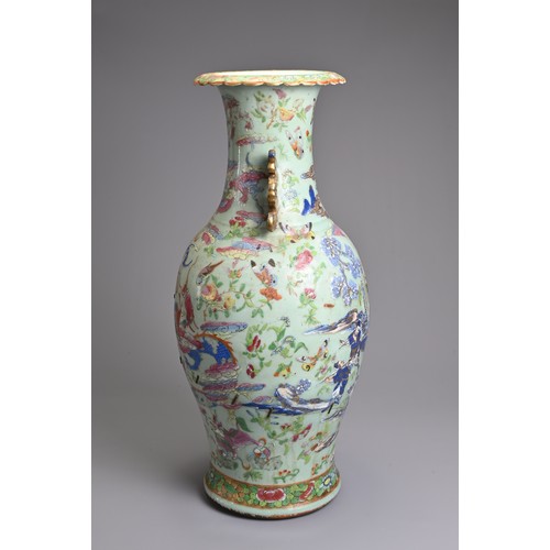 83 - A LARGE CHINESE CELADON GROUND FAMILLE ROSE PORCELAIN VASE, 19TH CENTURY. Of baluster form with rais... 