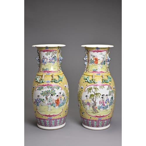 86 - A PAIR OF CHINESE YELLOW GROUND FAMILLE ROSE PORCELAIN VASES, EARLY 20TH CENTURY. Each of baluster f... 