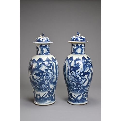 87 - A PAIR OF CHINESE BLUE AND WHITE PORCELAIN VASES AND COVERS, 19TH CENTURY. Decorated with battle sce... 