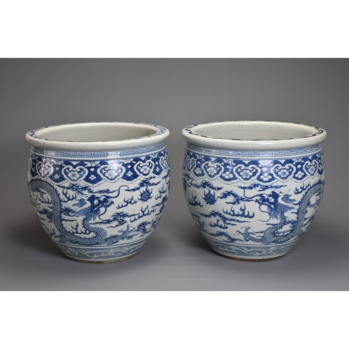 90 - A GOOD LARGE PAIR OF CHINESE BLUE AND WHITE PORCELAIN JARDINIERS, 19TH CENTURY. Heavily potted, deco... 