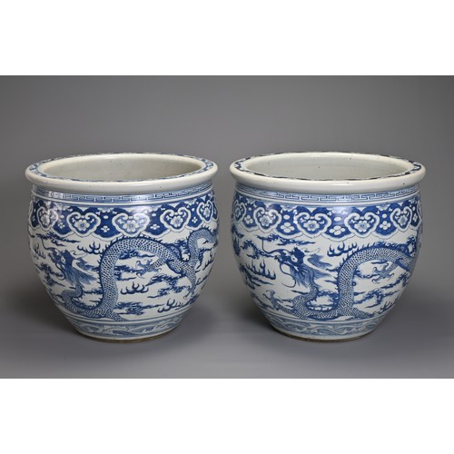 90 - A GOOD LARGE PAIR OF CHINESE BLUE AND WHITE PORCELAIN JARDINIERS, 19TH CENTURY. Heavily potted, deco... 