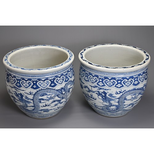 90 - A GOOD LARGE PAIR OF CHINESE BLUE AND WHITE PORCELAIN JARDINIERS, 19TH CENTURY. Heavily potted, deco... 