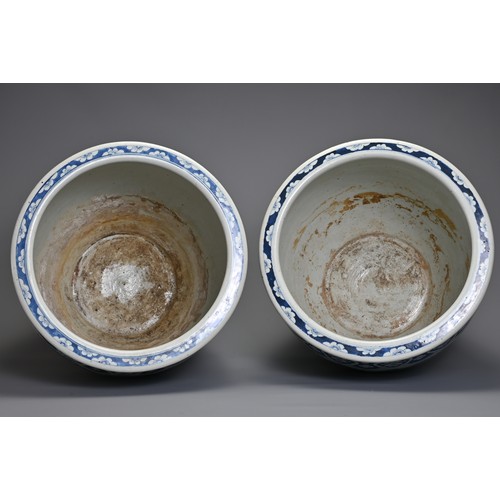 90 - A GOOD LARGE PAIR OF CHINESE BLUE AND WHITE PORCELAIN JARDINIERS, 19TH CENTURY. Heavily potted, deco... 