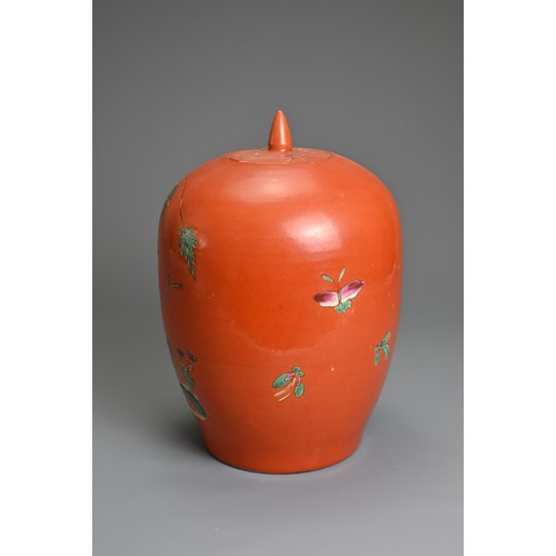 97 - A CHINESE CORAL GROUND PORCELAIN JAR AND COVER, 20TH CENTURY. Of ovoid form decorated with fruit tre... 