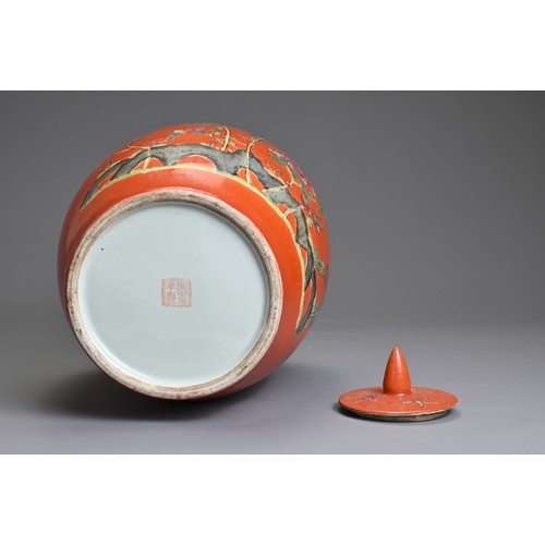 97 - A CHINESE CORAL GROUND PORCELAIN JAR AND COVER, 20TH CENTURY. Of ovoid form decorated with fruit tre... 