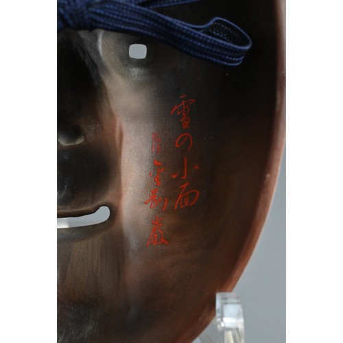 376 - A JAPANESE PORCELAIN SIGNED OKAME NOH MASK. Signed in red overglaze enamel to reverse, with red lips... 