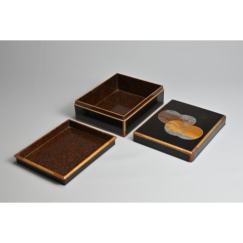 377 - A JAPANESE MEIJI PERIOD (1868-1912) RECTANGULAR BLACK AND GILT LACQUER BOX, COVER AND TRAY. The top ... 