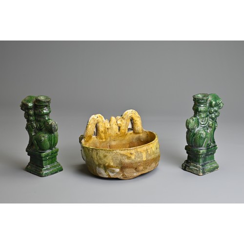 63 - TWO CHINESE GLAZED SHIWAN POTTERY ITEMS, 19/20TH CENTURY. To include a pair of green glazed joss sti... 