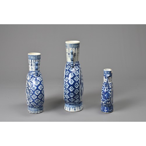 21 - THREE CHINESE BLUE AND WHITE PORCELAIN MOON FLASKS, 19TH CENTURY. Of graduating sizes decorated with... 