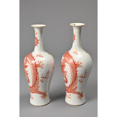 23 - A PAIR OF CHINESE IRON RED DECORATED BALUSTER VASES, 19/20TH CENTURY. Finely potted, decorated with ... 