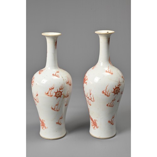 23 - A PAIR OF CHINESE IRON RED DECORATED BALUSTER VASES, 19/20TH CENTURY. Finely potted, decorated with ... 