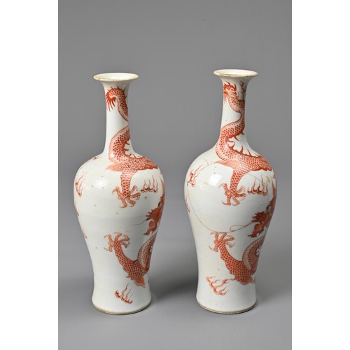 23 - A PAIR OF CHINESE IRON RED DECORATED BALUSTER VASES, 19/20TH CENTURY. Finely potted, decorated with ... 