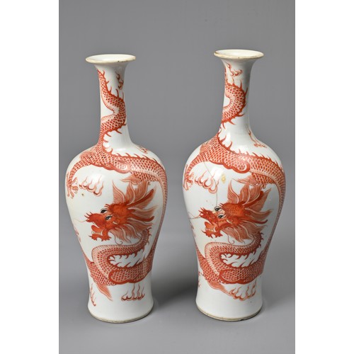 23 - A PAIR OF CHINESE IRON RED DECORATED BALUSTER VASES, 19/20TH CENTURY. Finely potted, decorated with ... 