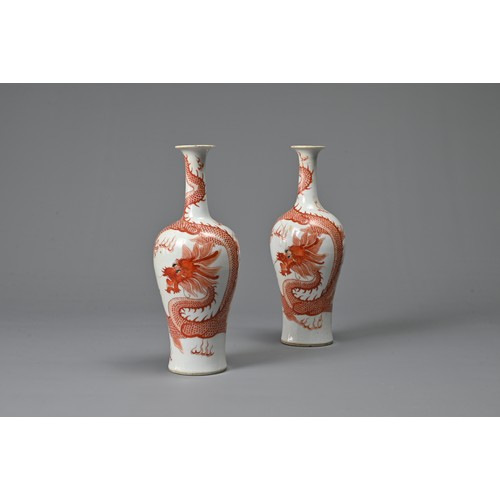 23 - A PAIR OF CHINESE IRON RED DECORATED BALUSTER VASES, 19/20TH CENTURY. Finely potted, decorated with ... 