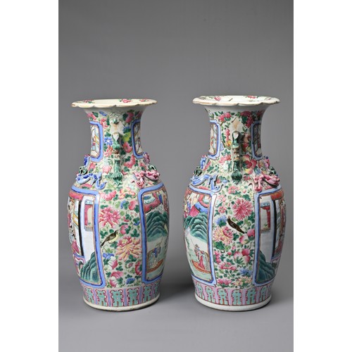 26 - A LARGE PAIR OF CHINESE FAMILLE ROSE PORCELAIN VASES, 19TH CENTURY. Of baluster form decorated with ... 