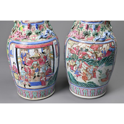 26 - A LARGE PAIR OF CHINESE FAMILLE ROSE PORCELAIN VASES, 19TH CENTURY. Of baluster form decorated with ... 