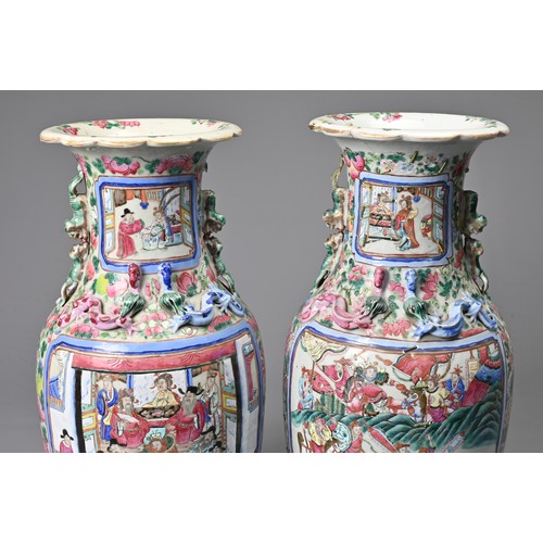 26 - A LARGE PAIR OF CHINESE FAMILLE ROSE PORCELAIN VASES, 19TH CENTURY. Of baluster form decorated with ... 