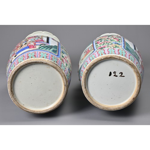 26 - A LARGE PAIR OF CHINESE FAMILLE ROSE PORCELAIN VASES, 19TH CENTURY. Of baluster form decorated with ... 