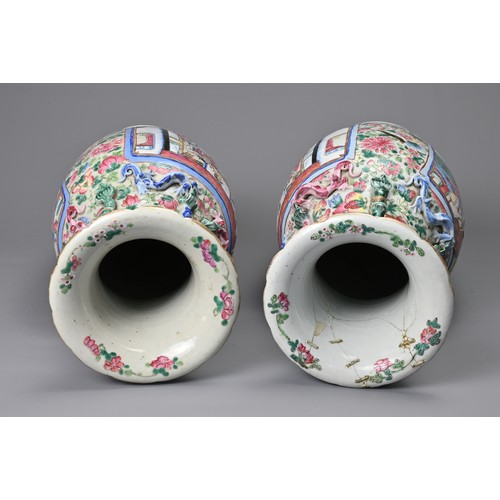 26 - A LARGE PAIR OF CHINESE FAMILLE ROSE PORCELAIN VASES, 19TH CENTURY. Of baluster form decorated with ... 