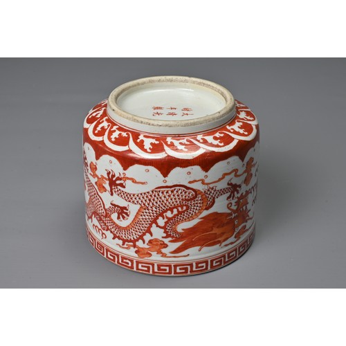 39 - A CHINESE IRON RED DECORATED PORCELAIN POT, GUANGXU MARK. Of cylindrical form decorated with dragons... 