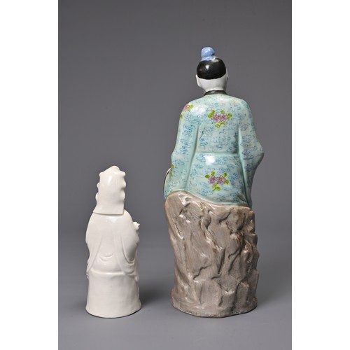 41 - TWO CHINESE PORCELAIN FIGURES, 20TH CENTURY. To include a polychrome decorated figure of a man seate... 