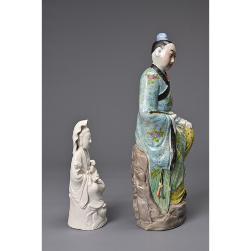 41 - TWO CHINESE PORCELAIN FIGURES, 20TH CENTURY. To include a polychrome decorated figure of a man seate... 