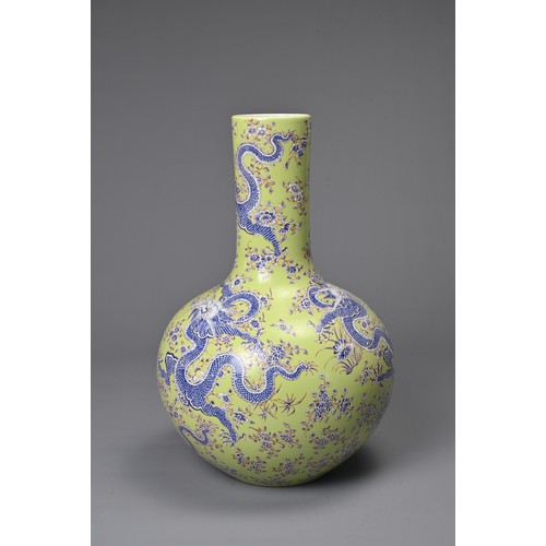 47 - A CHINESE LIME GREEN GROUND TIANQIUPING, KANGXI MARK, 20TH CENTURY. Globular body leading into a tal... 