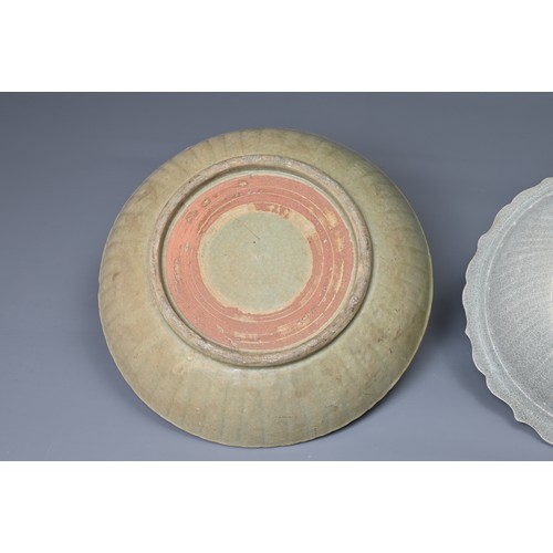 63 - TWO CHINESE CELADON GLAZED POTTERY BOWLS, YUAN / MING DYNASTY. Each heavily potted to include a brac... 