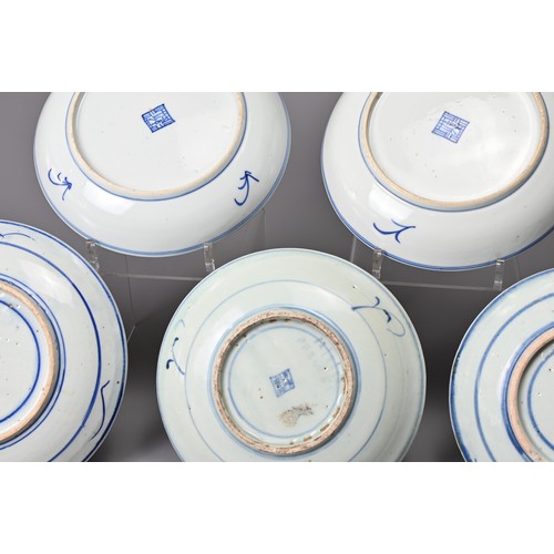 64 - A GROUP OF FIVE CHINESE BLUE AND WHITE PORCELAIN DISHES, 19TH CENTURY. Each with stylised floral dec... 